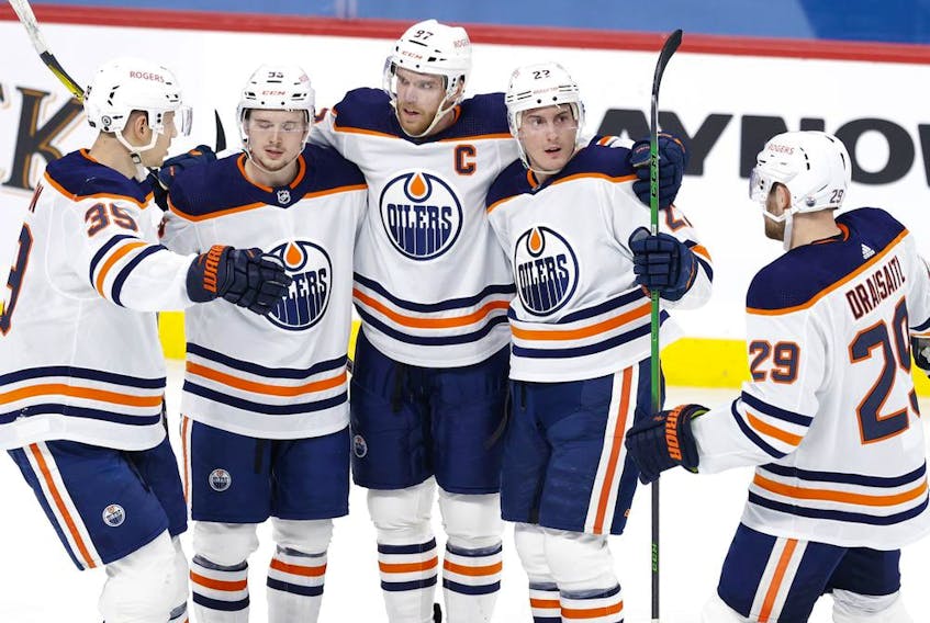 Edmonton Oilers defenseman Tyson Barrie (22) celebrates his second period goal against the Winnipeg Jets at Bell MTS Place on April 17, 2021. 
