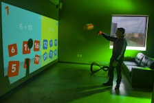 Geoff Baker, president of 3D Audio Visual Solutions in Dartmouth Crossing, gives a demonstration of the Lü Interactive Playground at his company's design studio on Friday, April 16, 2021.