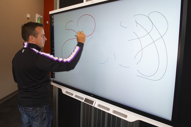 Geoff Baker, president of 3D Audio Visual Solutions, uses a Smart Technologies interactive white board at his company's design studio on Friday, April 16, 2021. - Ryan Taplin