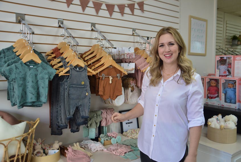 Rochelle Simmons, owner of Sawyer + Sunny Boutique, shows off some of the products on offer at the new downtown Sydney shop that is dedicated to mothers and babies. The new store is located on Charlotte Street. DAVID JALA/CAPE BRETON POST