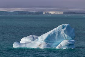 An iceberg floats near Philpots Island in Nunavut. As a northern country, Canada will be among the first to feel the impacts of climate change, says Brian Hodder.