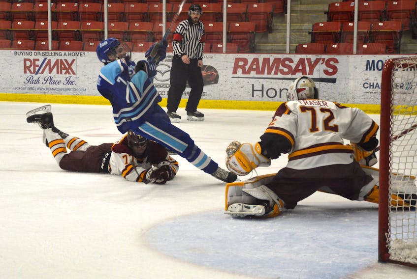Preston Pattengale of the Sydney Mitsubishi Rush, left, takes down Blake Pilgram-Edwards of the Steele Subaru Majors during Nova Scotia Under-18 Major Hockey League playoff action at the Membertou Sport and Wellness Centre on Saturday. Pattengale was issued a tripping penalty but the Majors didn't score on the power play. Sydney won Game 3, 7-2. JEREMY FRASER • CAPE BRETON POST