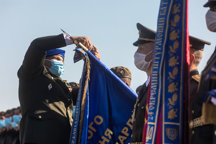 Soldiers take part in an August 2020 ceremonial flag raising at the military airfield in Vasylkiv, Kyiv region. 