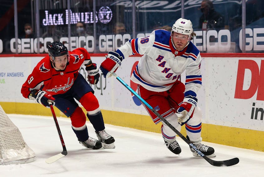 Brendan Lemieux still with the New York Rangers skates past Dmitry Orlov of the Washington Capitals  on March 19, 2021. 