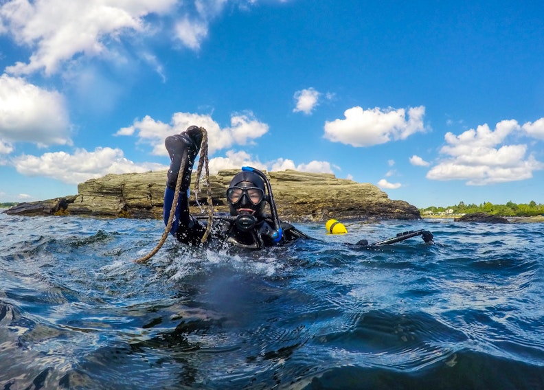 Alexa Goodman, project manager for the Coastal Action group of Nova Scotia, takes a dive for lost fishing gear off Southwest Nova Scotia in 2020.