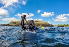 Alexa Goodman, project manager for the Coastal Action group of Nova Scotia, takes a dive for lost fishing gear off Southwest Nova Scotia in 2020.
