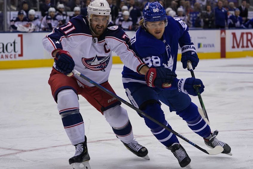 New Maple Leafs forward Nick Foligno battles with now teammate William Nylander when Foligno played for Columbus.