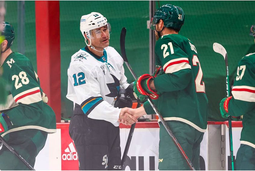  Minnesota Wild defenceman Carson Soucy (21) congratulates San Jose Sharks center Patrick Marleau (12) on his 1,767th career game played at Xcel Energy Center.