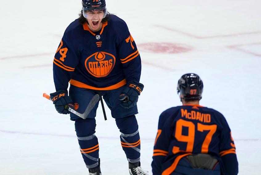 Edmonton Oilers defenceman Ethan Bear (74) celebrates his goal with teammate Connor McDavid (97) against the Montreal Canadiens on Monday, April 19, 2021, in Edmonton.