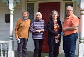 Paul and Jan Zann, left, Kathleen MacPherson and and Don Pugsley stand outside the John L. Doggett House, a provincial heritage property. They want town council to reconsider its planned consultation process for amendments that could allow a nearby heritage designated property to be rezoned for a 52-unit residential building. 
