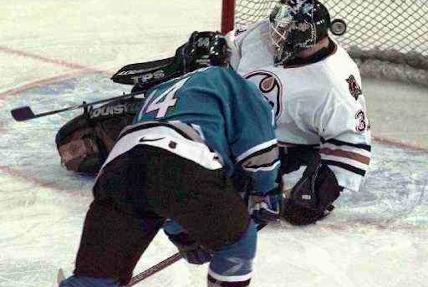 San Jose Sharks rookie forward Patrick Marleau scores on Edmonton Oilers netminder Curtis Joseph  in Edmonton on Feb. 4, 1998.