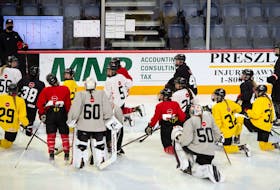 Team Canada players listen to head coach Troy Ryan during practice at the team's selection camp Monday at Scotiabank Centre in Halifax. The International Ice Hockey Federation has cancelled the women's world championship, which was scheduled for Halifax and Truro next month. - Hockey Canada Images