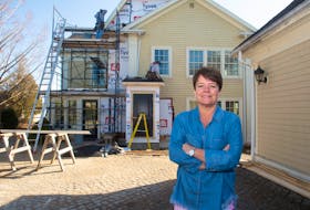 Beatrice Stutz, owner of Le Caveau restaurant at Domaine de Grande Pre, poses for a photo on Wednesday, March 24 in front of a new inn which is currently undergoing extensive renovations at the winery.
Ryan Taplin - The Chronicle Herald
