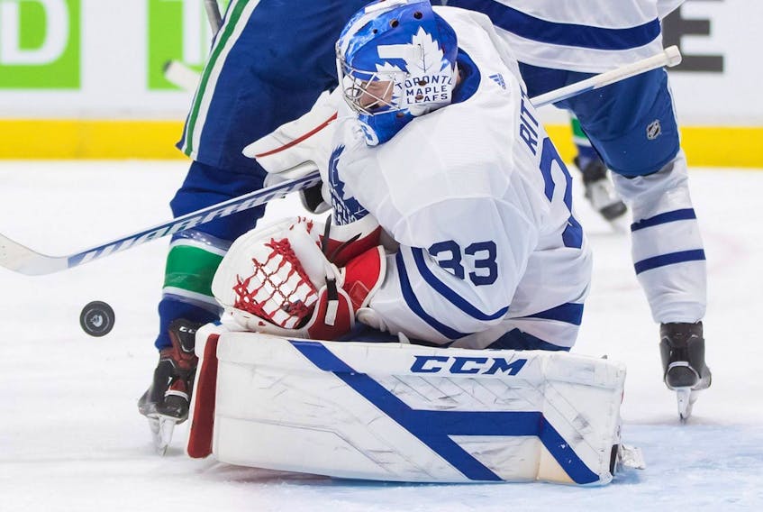 Maple Leafs goalie David Rittich makes a save against the Canucks during the second period of an NHL game in Vancouver, Tuesday, April 20, 2021.