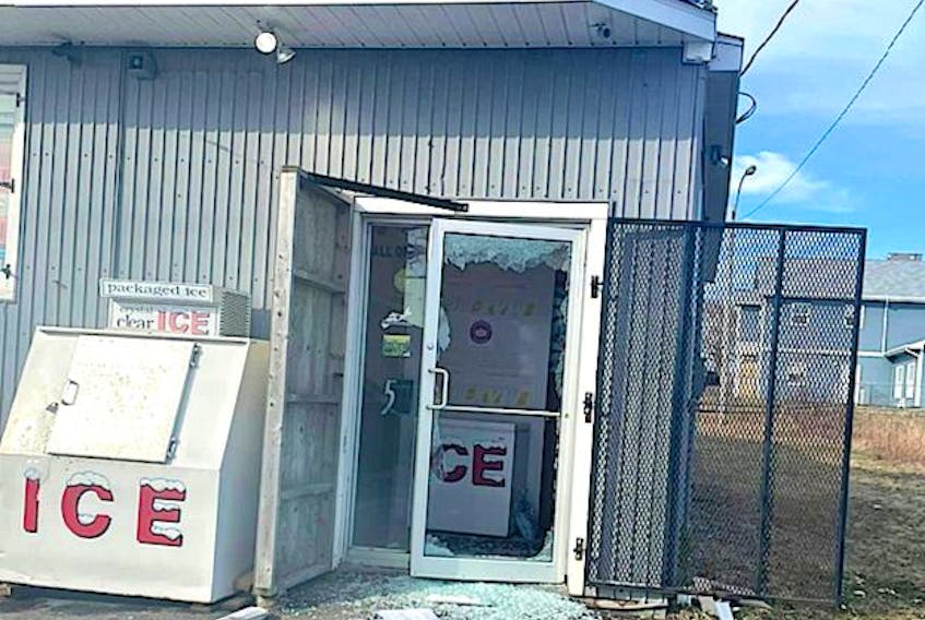 The smashed front door of Cletus' Corner Convenience Store on West Street in Glace Bay, Wednesday morning. Cape Breton Regional Police are investigating the break, enter and theft of the convenience store and the robbery of a Bud’s Taxi driver in Glace Bay, which occurred 20 minutes apart. CONTRIBUTED • FACEBOOK