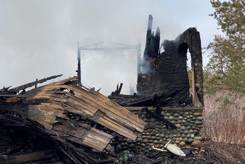 Once a beautiful home, all that remains of this abandoned house in Pleasant Lake is charred rubble after a suspicious fire on April 12. CARLA ALLEN • TRICOUNTY VANGUARD - Saltwire network