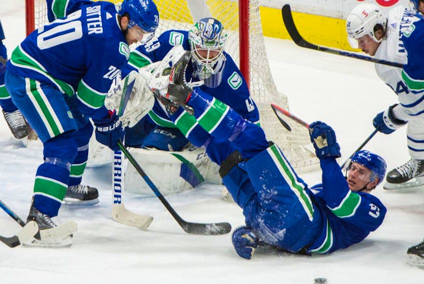  Canucks defenceman Tylers Myers takes a tumble during their game Sunday against the Toronto Maple Leafs.