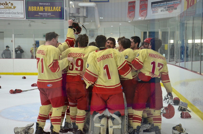 The Arsenault’s Fish Mart Western Red Wings celebrate winning the Island Junior Hockey League championship on Wednesday night. The Red Wings defeated the Sherwood-Parkdale A&S Scrap Metal Metros 6-1 to win the best-of-seven final series 4-1. - Jason Simmonds