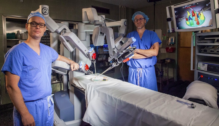 The QEII’s Dr. Ross Mason (left) and Dr. Ricardo Rendon (right) with Atlantic Canada’s first surgical robotics technology, which is fully funded by QEII Foundation donors. - Photo Courtesy QEII Foundation.