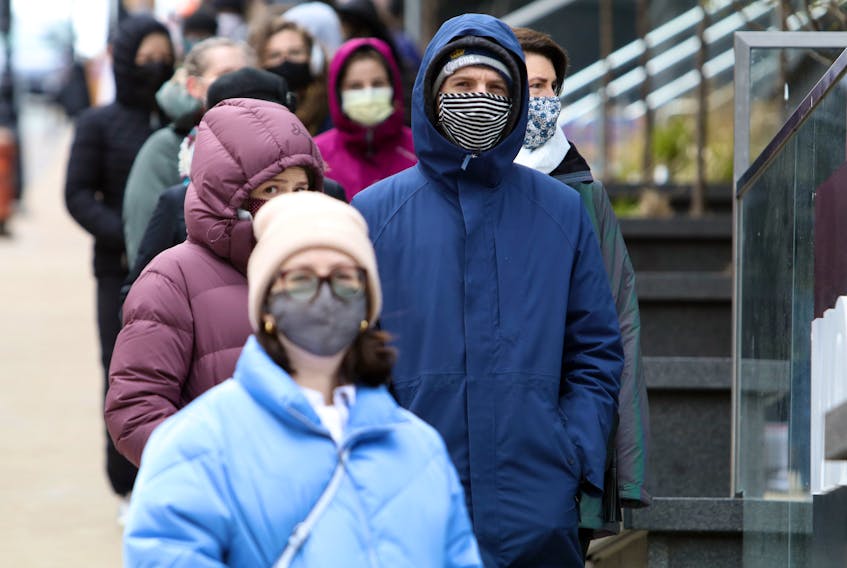 Nova Scotians lined up and masked up for asymptomatic testing at the Halifax Convention Centre Friday. Mask wearing is one of the many measures that is being strongly recommended to prevent the spread of COVID-19.