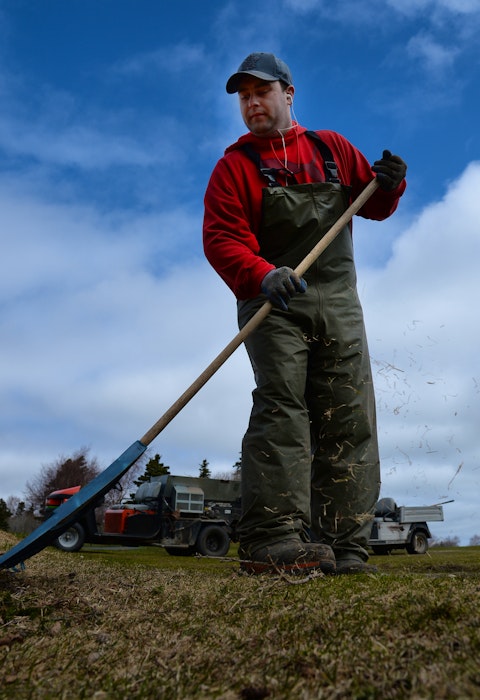 Bally Haly employee Tyler Smith cleans up the grounds at the golf course Wednesday morning.— Keith Gosse/The Telegram