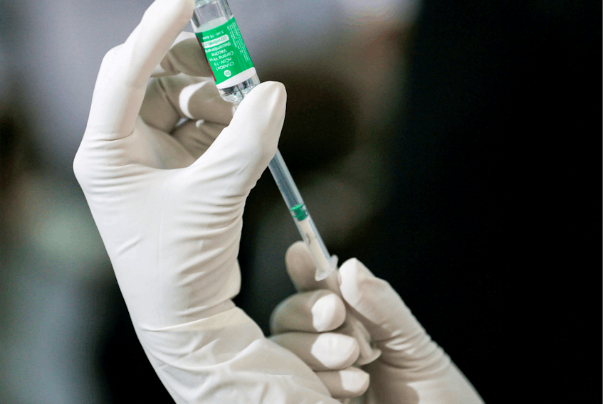 A health official draws a dose of AstraZeneca’s COVID-19 vaccine manufactured by the Serum Institute of India.
