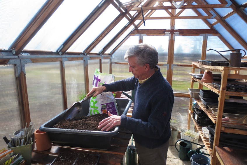 Mark Cullen enjoys getting soil ready for container gardening.