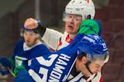  Ottawa Senators Brady Tkachuk winds up to punch Vancouver Canucks Travis Hamonic in a fight during NHL action at Rogers Arena in Vancouver, BC, April 22, 2021.