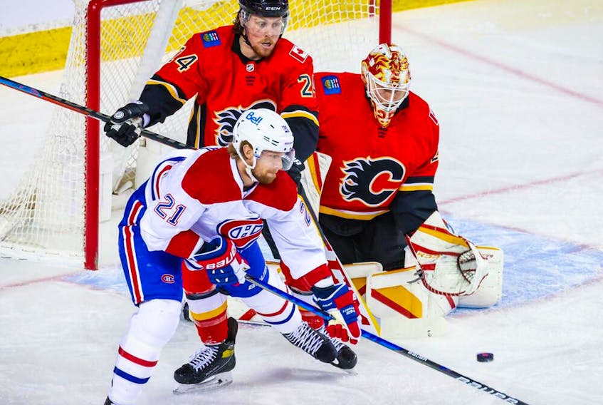 Flames goaltender Jacob Markstrom makes a save against Canadiens' Eric Staal (21) during the first period at Scotiabank Saddledome in Calgary on Saturday, April 24, 2021. 