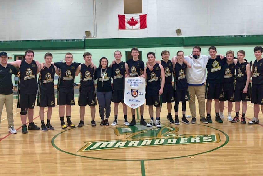The Memorial Marauders took home the Nova Scotia School Athletic Federation junior varsity boys basketball championship last week with a 64-61 victory over the Sydney Academy Wildcats at Memorial High School gym in Sydney Mines. Members of the team are shown with the championship banner. From left, Eddie Power (assistant coach), John Taylor, Matthew MacNeil, Lyndon Quirk, Riley Ford, Amanda Styles (head coach), Aaron Young, Cameron LeBlanc, Nolan Ryan, Kirk Shebib, Austen Carey, Bobby Jessome (assistant coach), Lucas Penney, Colby Skinner, Matthew MacKenzie and Hunter Donovan. PHOTO SUBMITTED.