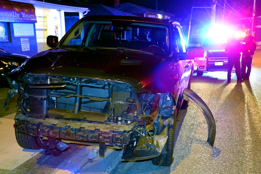 A driver and his damaged pickup were located shortly after a high-speed hit-and-run collision in St. John's Sunday night. - Keith Gosse/The Telegram