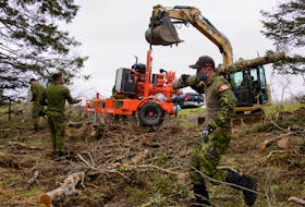 Members of the Maritime Explosive Ordnance Disposal (MEOD) Team from Fleet Diving Unit (Atlantic) work to remove a 500 lb UXO from the Second World War in the vicinity of Chebogue, Yarmouth County. Part of this included  making access to the site, which is a pond.  PHOTO:  Master Corporal Ian Thompson, Canadian Armed Forces