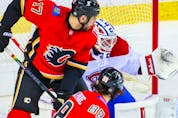 Calgary Flames left wing Andrew Mangiapane scores a goal against Montreal Canadiens goaltender Jake Allen at Scotiabank Saddledome.