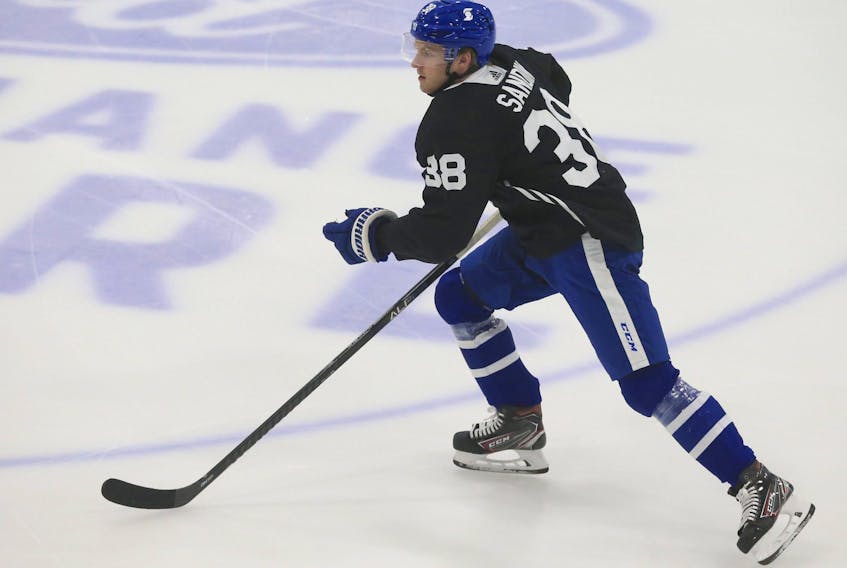  Maple Leafs' Rasmus Sandin heads up through centre ice at a practice in Toronto.