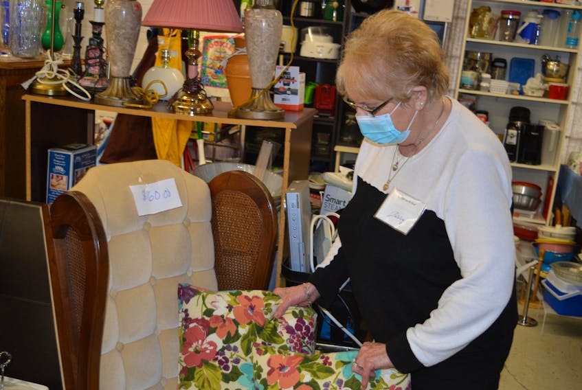 Volunteer Shirley Wood helps out in the warehouse at Gifts from the Heart in Charlottetown on Monday.