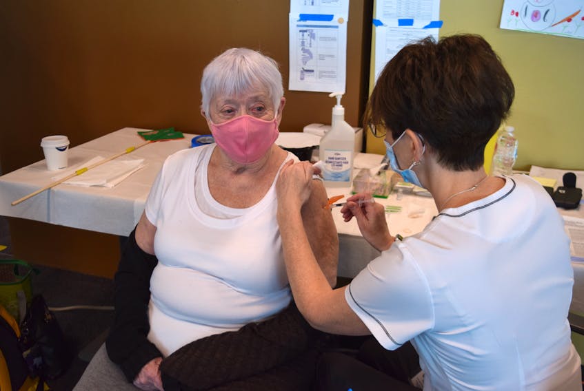Louella Mackenzie receives her first dose of the Pfizer-BioNTech COVID vaccine during the first week of clinics for people over 80 at the NSCC in Truro.