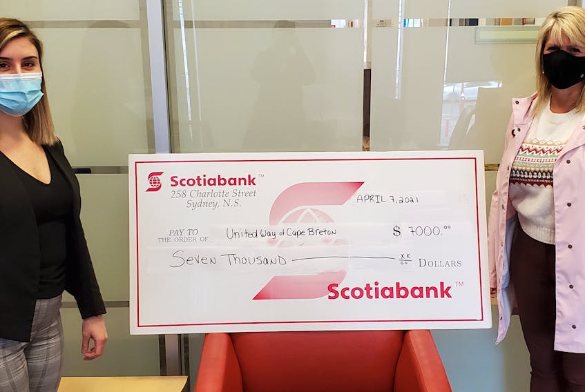 Laura Murrant, left, a financial adviser at the Charlotte Street branch of Scotiabank in Sydney, recently presented a cheque for $7,000 from the bank to Lynne McCarron, executive director of the United Way of Cape Breton. CONTRIBUTED
