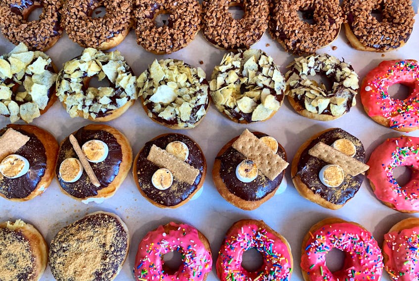 A selection of treats from Burchie's Gourmet Donuts. Pictured are the flavours chocolate Skor chip, chip 'n' dip, s'mores, blueberry cheesecake and classic pink sprinkle, chef Alexandria Nash said.