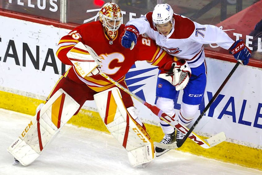  Calgary Flames goalie Jacob Markstrom battles Montreal Canadiens Jake Evans in third period NHL action at the Scotiabank Saddledome in Calgary on Monday, April 26, 2021. Darren Makowichuk/Postmedia