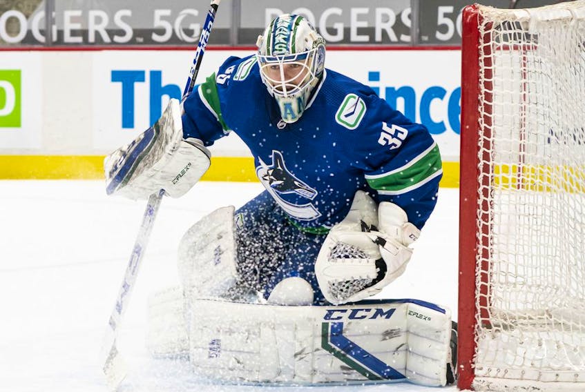 Vancouver Canucks goalie Thatcher Demko readies to make a save during NHL action against the Winnipeg Jets at Rogers Arena on March 22, 2021 in Vancouver, Canada.