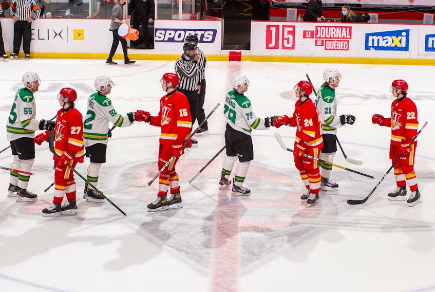 Xavier Bernard, left, and his Val-d'Or Foruers teammates shake hands with the Baie-Comeau Drakkar following the final game of their Quebec Major Junior Hockey League playoff series on Tuesday.