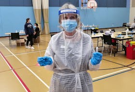 From head-to-toe, Linda Hallett was dressed up in personal protective equipment to test Nova Scotians for COVID-19 at the East Dartmouth Community Centre on Wednesday.