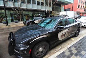 Vancouver Police on scene at Telus Gardens at 777 Richards St., in Vancouver, BC., on January 31, 2021. A penthouse apartment was found to be hosting nightclub like parties two weeks in a row in violation of COVID-19 rules. 