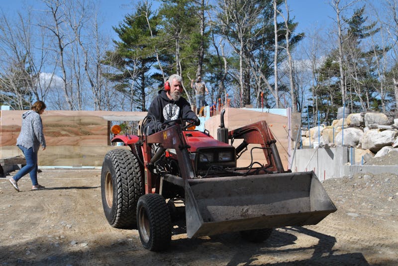 Tom Torak heads back to the mixer for another load of rammed earth for the exterior wall construction of his new home in Hartz Point just outside Shelburne in Birchtown.  KATHY JOHNSON - Saltwire network