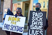  Protesters in Ontario call for paid sick leave earlier this year.