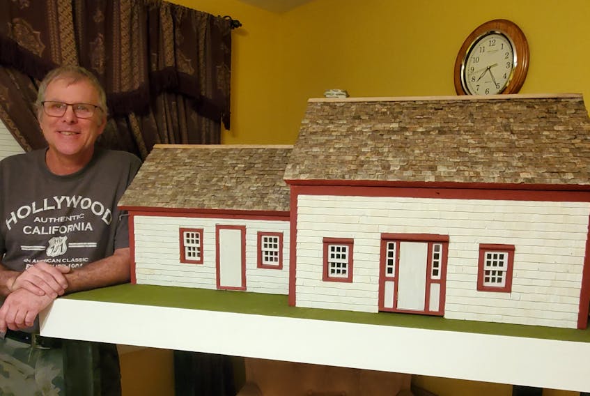 Darryl Crosby, the 2021 representative volunteer for the Municipality of Argyle, poses with the replica of the historic Williams house he built. Contributed