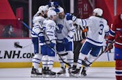 Maple Leafs' Jake Muzzin celebrates his goal with teammates Adam Brooks, Joe Thornton and Justin Holl during the second period against the Montreal Canadiens at the Bell Centre on Wednesday, April 28, 2021 in Montreal, Canada. 