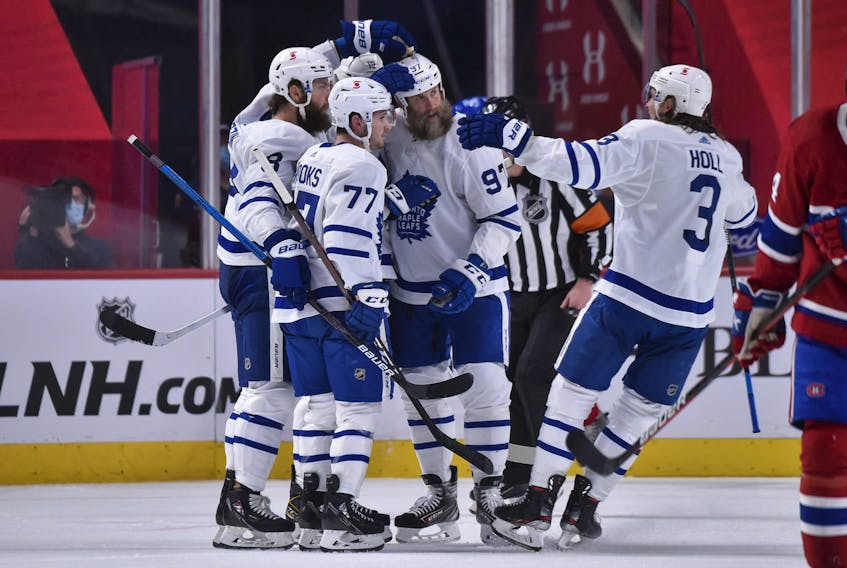 Maple Leafs' Jake Muzzin celebrates his goal with teammates Adam Brooks, Joe Thornton and Justin Holl during the second period against the Montreal Canadiens at the Bell Centre on Wednesday, April 28, 2021 in Montreal, Canada. 