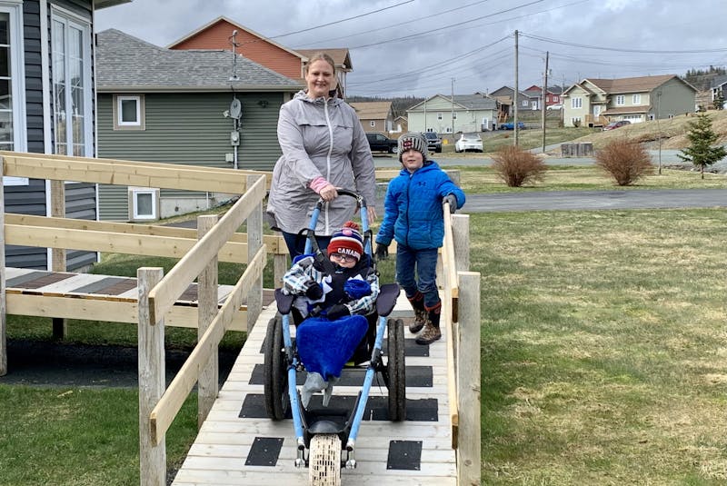 Adina Stamp of Bay Bulls loves to get outside with her five-year-old sons, Lyndon and Zander. She said the new wheelchair for Lyndon allows them to explore off-road hiking trails and areas of the province. - Rosie Mullaley