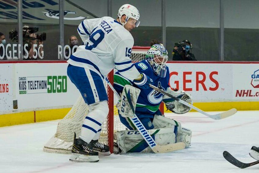 Vancouver Canucks goalie Braden Holtby makes a save on Maple Leafs forward Jason Spezza on April 19. Approaching his 38th birthday, Spezza is having a strong season with Toronto.